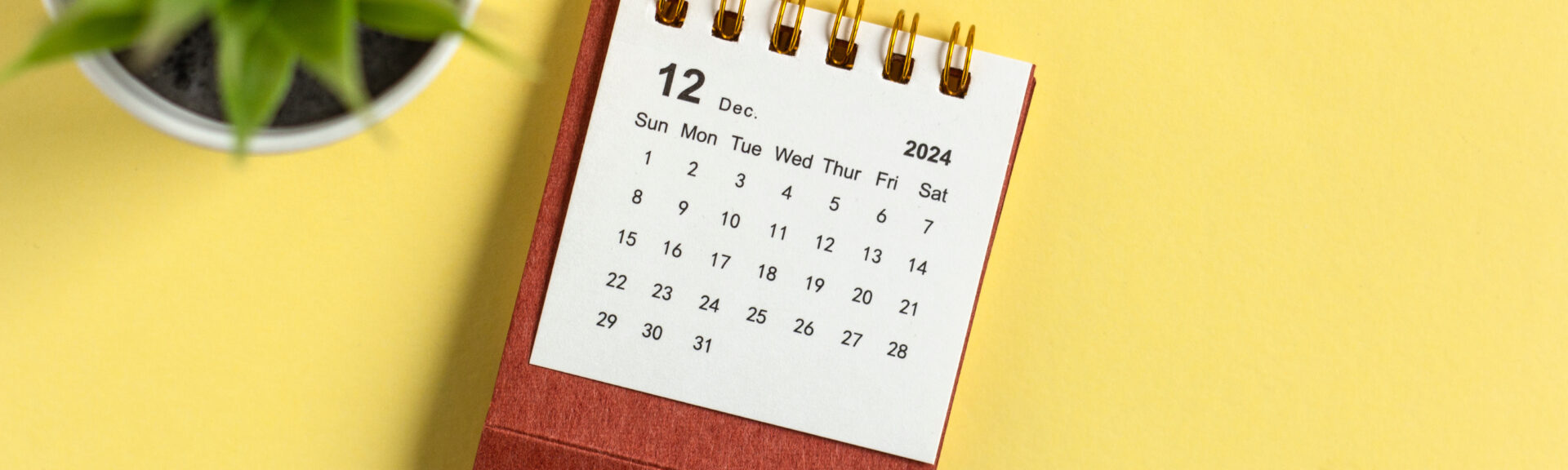 December 2024. Monthly desk calendar for 2024 on a yellow background