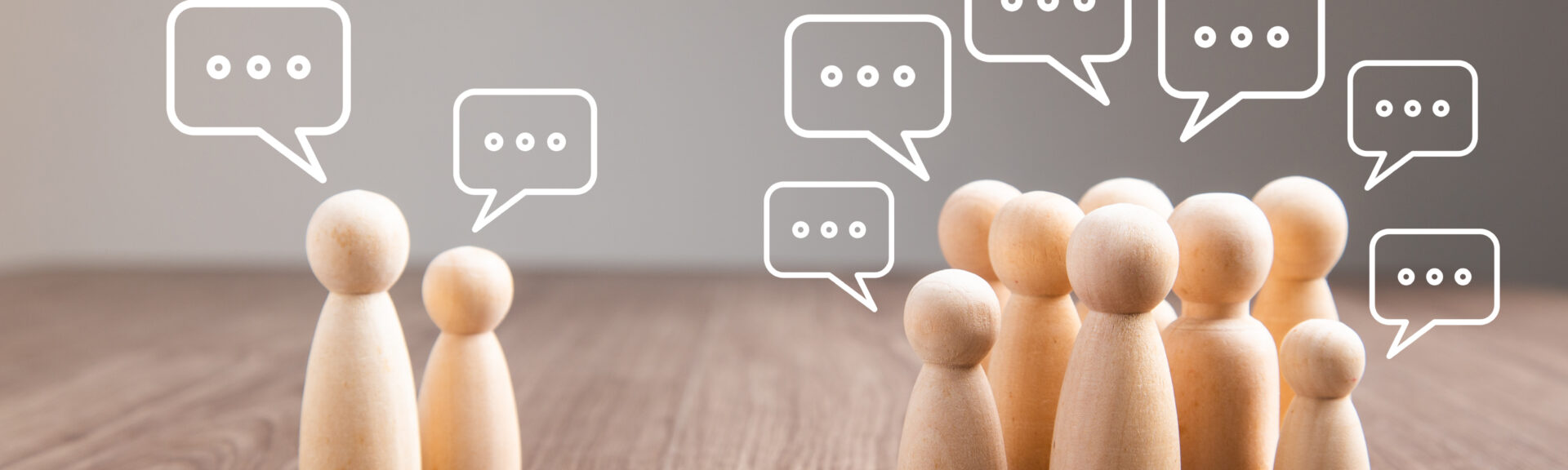 Mingle, discussion, chatting concept. Wooden figurine with speech bubble